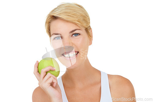 Image of Woman, portrait and green apple in studio for diet, wellness or fitness on white background, mockup or backdrop. Model, dietician or nutritionist with healthy fruit for vitamins, cleanse and workout