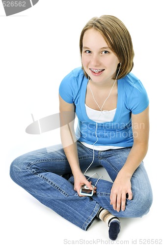 Image of Teenage girl listening to music
