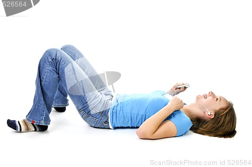 Image of Teenage girl listening to music