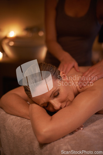 Image of Woman, masseuse and spa day for wellness, relax and self care and back massage on table being happy. Female person, holistic health and pampering to destress, peace and detox for luxury treatment