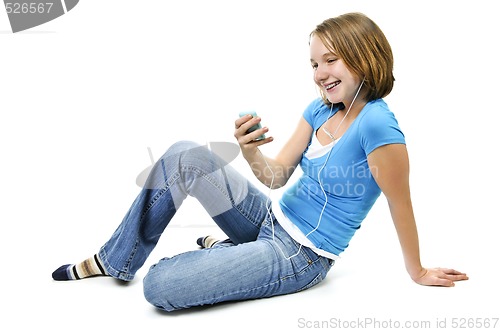 Image of Teenage girl listening to music