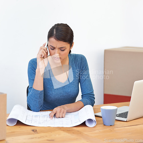 Image of Woman, phone and call with blueprint for planning, communication and scheduling in home office. Female architect, point and concentration with smartphone, laptop and paper for project management