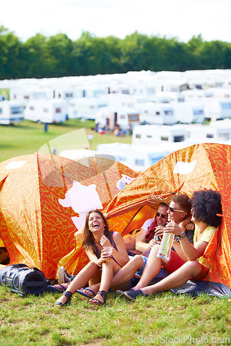 Image of Happy, friends and laughing in tent at funny festival for joke, comedy or humor at outdoor campsite. Friendship, young group or people enjoying fun holiday weekend, event or camping on grass at party