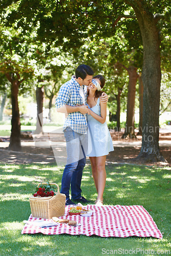 Image of Date, picnic and surprise with couple in park for romance, bonding and summer vacation. Happiness, commitment and relax with man and woman in love in nature for blindfold, support and relationship