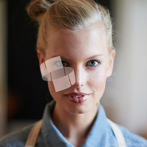 Image of Portrait, waitress and woman in a cafe as a small business owner ready for service closeup. Restaurant, face and female person in an apron with confidence and working in a kitchen for barista career