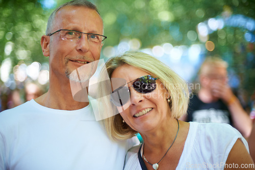 Image of Senior couple, portrait and happy at music festival in nature, excited and bonding with love in forest. Mature man, woman and smile on face at summer carnival and care on retirement holiday in europe