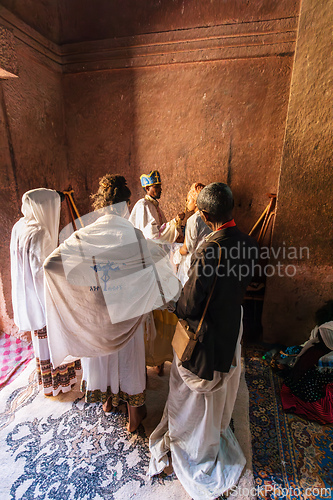 Image of Orthodox Christian baptism ceremony at St. George Church captures a sacred moment in Ethiopian spiritual life.