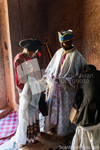 Image of Orthodox Christian baptism ceremony at St. George Church captures a sacred moment in Ethiopian spiritual life.