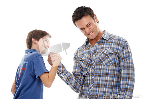 Image of Father, portrait and arm wrestle with child for game of strength, power or playful bonding on a white studio background. Dad, son or kid with handshake in battle for challenge, parenting or childhood