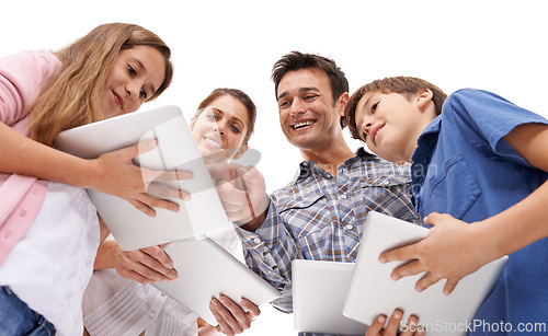 Image of happy, family and children with tablet on a white background for internet, website or online games. Family, below and mom, dad and kids on digital tech for streaming, connection and videos in studio