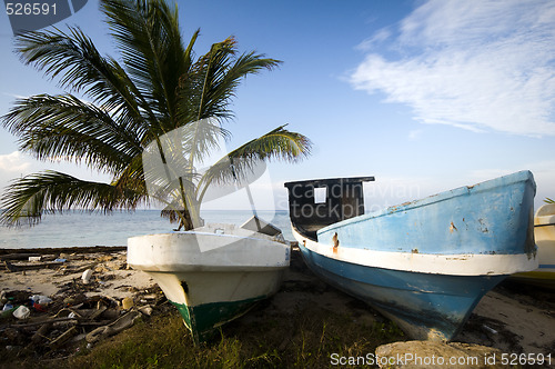 Image of  fishing boats on shore caribbean sea