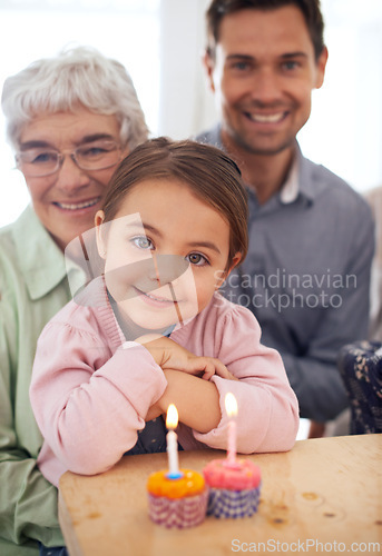 Image of Girl kid in portrait, birthday party and cupcake with candle for celebration, family and smile for special event at home. Grandmother, father and child with happy people for anniversary and dessert