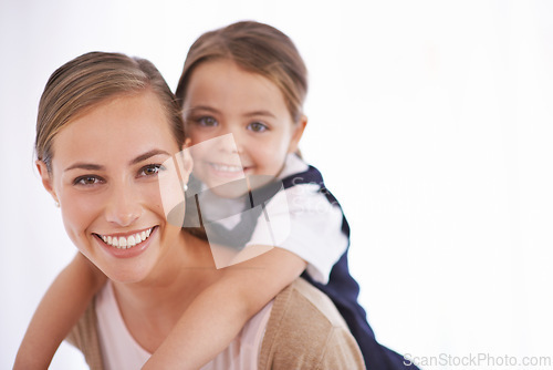 Image of Mother, kid and piggyback in portrait in studio with games, love and bonding with smile while playing on white background. Playful woman, young girl and happy with fun time together for childhood