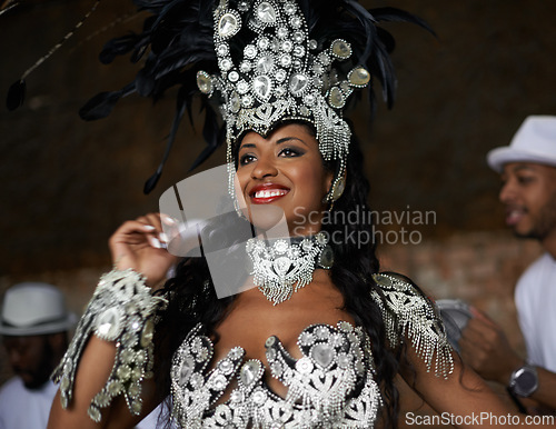 Image of Dancer, happy and samba performance at night for celebration in Rio de janeiro for carnival season. Female person, costume and feathers for culture and show, creativity and confidence at festival