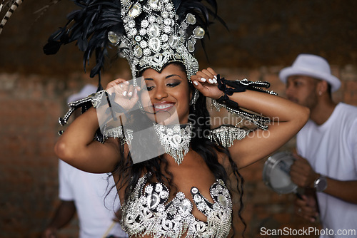Image of Woman, happy and samba performance at night for celebration in Rio de janeiro for carnival season. Female person, costume and feathers for culture and life, creativity and confidence at festival