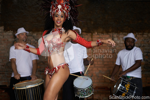 Image of Happy woman, portrait and samba dancer with band for performance at outdoor carnival in traditional costume. Female person or exotic performer dancing by musical group for party or concert in Rio