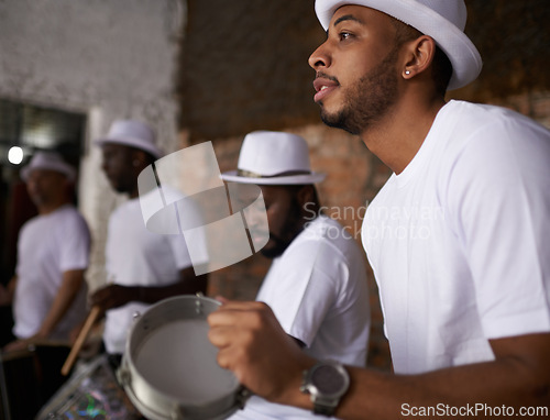 Image of Man, percussion and night with band playing music for performance, concert or musical event. Male person or group of musicians playing instruments in late evening for sound or fun local entertainment