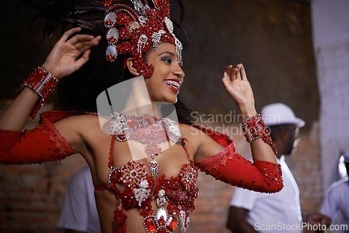 Image of Happy woman, samba dancer and performance with costume for tradition at carnival or festival. Face of female person or exotic performer with band for culture or dancing at party or concert in Rio