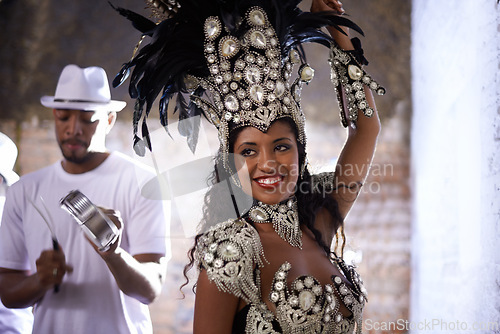 Image of Woman, band and samba performance at night for celebration in Rio de janeiro for carnival season. Female person, costume and feathers for culture and life, creativity and confidence at festival