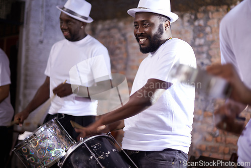 Image of Carnival, drummer and music with band in Brazil for entertainment, festival or performance event. Smile, concert and black man playing drums in Rio de Janeiro for culture, heritage or tradition