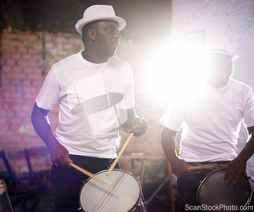 Image of Man, drums and band playing with instrument at festival, carnival or party together with lens flare. Male person, talented drummer or young group of musicians at night concert or music event in Rio