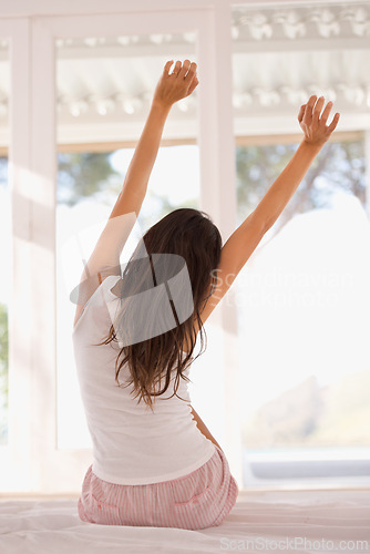 Image of Wake up, stretching or back of woman in bed for resting in pyjamas or peace alone in home to relax. House, morning or calm female person in apartment on break or time off ready to begin or start day