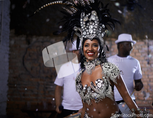 Image of Samba, woman and dancer with band at carnival in rio de janeiro for brazilian festival with feather costume or smile. Person, face or night with dancing, fashion or music for culture or outdoor event