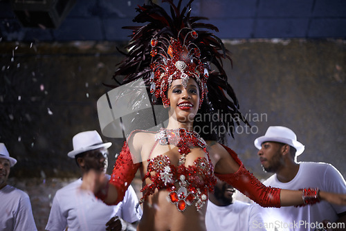 Image of Woman, dance and samba for music festival, carnival or street performance with costume at night. Excited dancer with drummer or band for event, celebration and culture with confetti in Rio de Janeiro