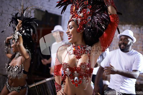 Image of Happy woman, samba and dance at music festival, carnival or night performance with costume and band. Excited dancer, group and drummer for event, celebration and culture or history in Rio de Janeiro