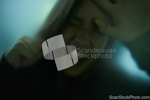 Image of Scary, scream and woman with hand on glass, window or person trapped in home. Girl, shadow and figure in horror, drama or creepy aesthetic with angry shouting from terror in house with fog on screen