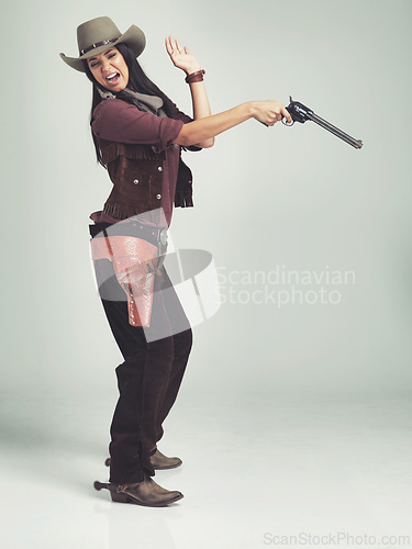 Image of Cowgirl, woman and shooting gun, pistol or weapon in studio with costume isolated on white background mockup. Western, criminal and female person with revolver, scared or screaming in fear in Texas