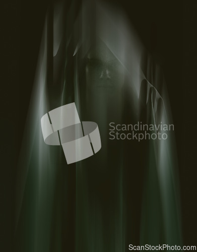 Image of Person, hands and ghost face with mystery on black background for halloween horror, scary or evil. Dark, apparition and late night terror with glow shadows or spooky demon, nightmare or hallucination