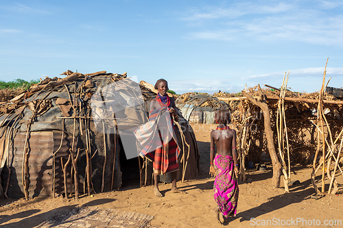 Image of Dasanesh woman in traditional African village, Omorate, Omo Valley, Ethiopia