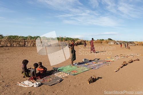 Image of Dasanesh children offering handmade souvenirs, Omorate, Omo Valley, Ethiopia