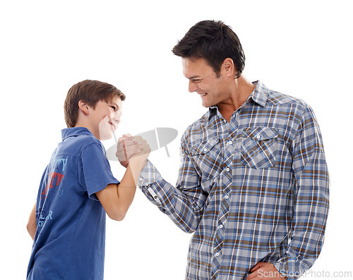 Image of Father, arm wrestle and child with strength for game of power or playful bonding on a white studio background. Dad, son or kid with friendly handshake in battle for challenge, parenting or childhood