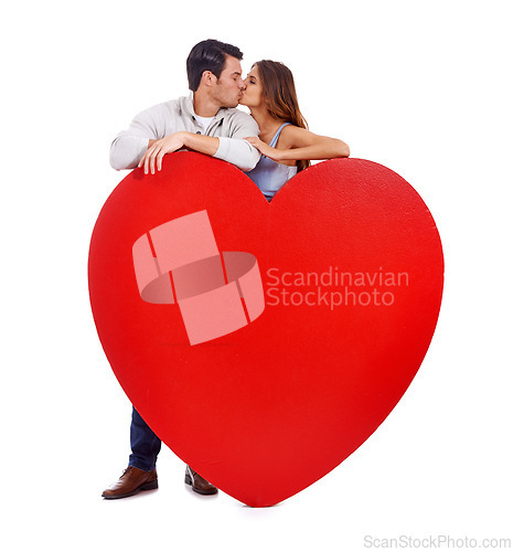 Image of Couple, kiss and heart paper in studio for romance, love and care with affection and mockup on a white background. Young woman and man with red poster, shape and marketing space for valentines day