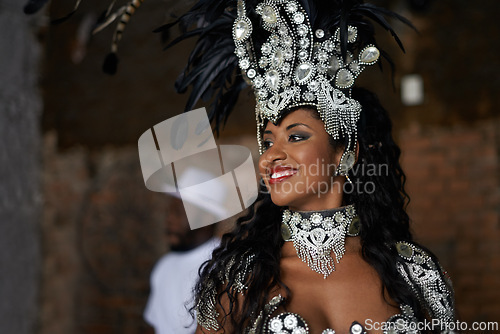 Image of Happy woman, samba dancer and tradition with costume for performance at carnival or festival. Face of female person or exotic performer with smile and cultural fashion for dancing or concert in Rio