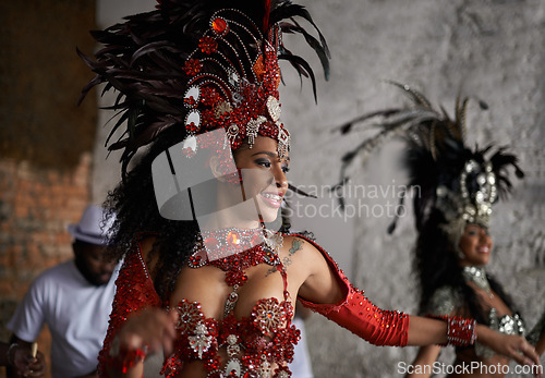 Image of Carnival, dancing and woman in costume for event in Brazil, performer or dancer with gemstone outfit outdoor. Music, band and samba with happiness for entertainment and culture, festival and talent