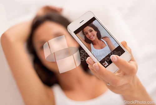 Image of Woman, selfie and phone screen in morning, bed and relax with photography on web blog. Girl, person and influencer for profile picture, click and ux for live streaming in bedroom on social network