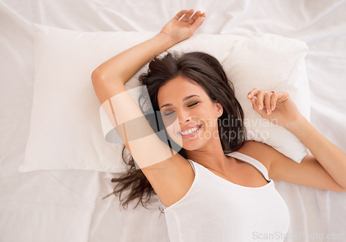 Image of Morning, relax or top view of woman in bed for resting in pyjamas to wake up alone in home. House, peace or above of excited female person on break or pillow with smile, ready to start day or chill