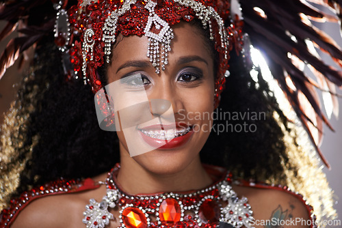 Image of Woman, portrait and samba performance at night for carnival season in Rio de janeiro, celebration and happy with costume for culture. Female person, festival and unique fashion for dancing at parade