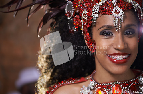 Image of Woman, portrait and samba dancer at night for carnival season in Rio de janeiro, celebration and happy with costume for culture. Female person, festival and unique fashion for performance at parade