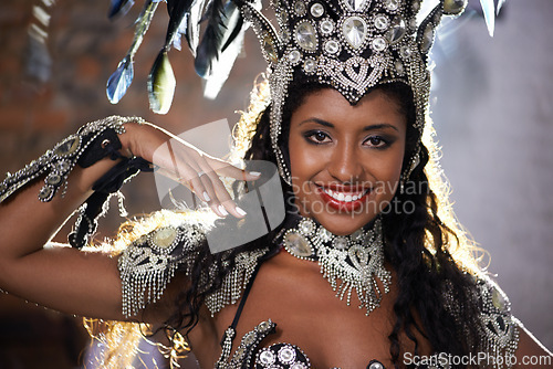 Image of Happy woman, portrait and samba dancer with costume for performance at carnival or festival. Face of female person or exotic performer with smile and cultural fashion for dancing or concert in Rio