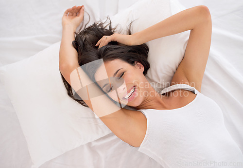 Image of Wake up, relax or top view of happy woman in bed for resting in pyjamas or peace alone in home. House, morning or above of an excited female person on break or pillow with smile to start day or chill