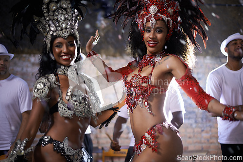 Image of Samba, portrait and performance of women in Rio de Janeiro, smile and dancing for crowd with energy. Female people, artistic and clothes from feather for fashion with culture, music and celebration