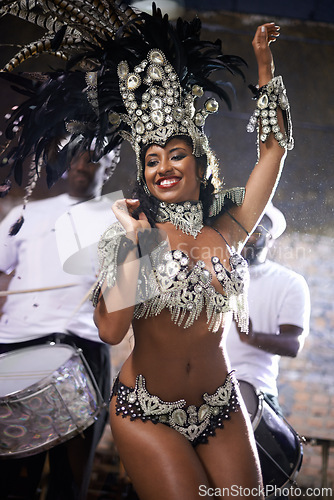 Image of Carnival, dance and woman for performance in Brazil, dancer with gemstone outfit and feather head gear outdoor. Music, samba and happiness for event and culture with festival entertainment and talent