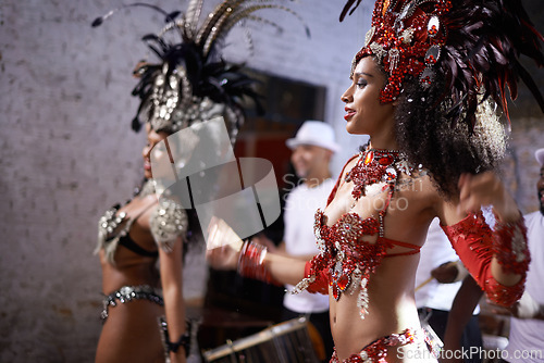 Image of Women, dancer and samba for carnival and music festival or night performance with costume and band. Group, dancing and drums for event, celebration and culture or history in Rio de Janeiro, Brazil