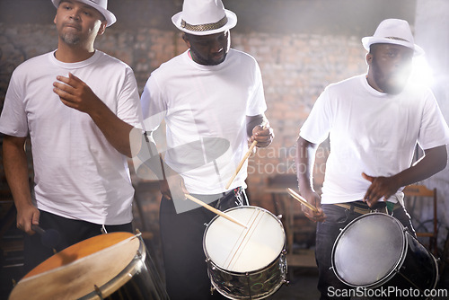 Image of Man, drums and group band playing with instrument at festival, carnival or night party with lens flare. Male person, talented drummer or young musicians at concert for music performance and audition