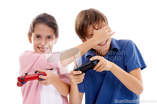 Image of Kids, gaming and controller for siblings in studio, portrait and cover eyes by white background. Girl, boy and family children with video game, press and contest with strategy, cheating or playing