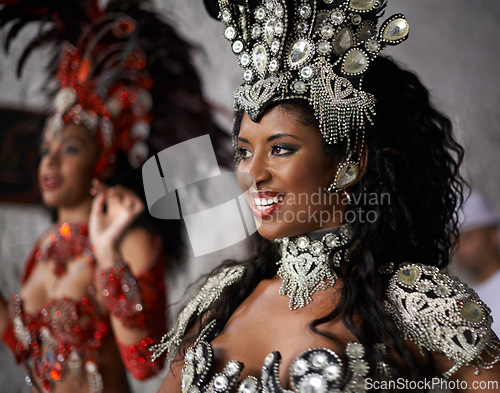 Image of Happy woman, samba dancer and traditional costume for performance at carnival or festival in fashion. Face of young female person or exotic performer with smile for dancing at party or concert in Rio